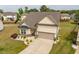 Residential neighborhood with a two-car garage, neat landscaping, and a paved driveway at 404 Lily Pad Ct, Zebulon, NC 27597