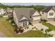 Charming home with a manicured lawn, a two-car garage, and lush greenery at 404 Lily Pad Ct, Zebulon, NC 27597