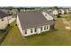 Spacious backyard with well-kept lawn and a covered patio, perfect for outdoor entertaining at 404 Lily Pad Ct, Zebulon, NC 27597