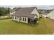 Spacious backyard featuring a screened porch and green lawn, perfect for outdoor activities at 404 Lily Pad Ct, Zebulon, NC 27597