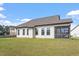 Backyard with a covered screened porch offering a relaxing outdoor space at 404 Lily Pad Ct, Zebulon, NC 27597