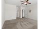 Large bedroom with neutral carpet, a ceiling fan and adjoining bathroom access at 404 Lily Pad Ct, Zebulon, NC 27597