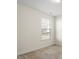 Cozy bedroom features neutral carpet and blinds for natural light at 404 Lily Pad Ct, Zebulon, NC 27597