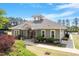 Attractive clubhouse featuring a welcoming entrance, lush greenery, and community amenities at 404 Lily Pad Ct, Zebulon, NC 27597