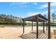 Community pool area featuring shaded seating and a splash pad, ideal for Gathering fun and relaxation at 404 Lily Pad Ct, Zebulon, NC 27597