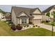 Attractive home with a two-car garage, neat landscaping, and a paved driveway at 404 Lily Pad Ct, Zebulon, NC 27597