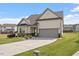 This home has a two car garage, front yard with landscaped flower beds and is located in a Gathering-friendly neighborhood at 404 Lily Pad Ct, Zebulon, NC 27597