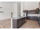 Kitchen island featuring a granite countertop, stainless steel appliances, and hardwood floors at 404 Lily Pad Ct, Zebulon, NC 27597