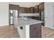 Granite countertops accent this modern kitchen with stainless steel appliances at 404 Lily Pad Ct, Zebulon, NC 27597