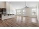 Open-concept living area with high ceilings and luxury vinyl plank flooring at 404 Lily Pad Ct, Zebulon, NC 27597