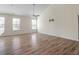 Spacious living area with wood-look floors and bright natural lighting at 404 Lily Pad Ct, Zebulon, NC 27597