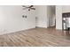 Inviting living area with luxury vinyl plank floors and adjacent kitchen at 404 Lily Pad Ct, Zebulon, NC 27597