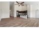 Bright open-concept living space with luxury vinyl plank and kitchen view at 404 Lily Pad Ct, Zebulon, NC 27597