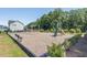 Community playground with swings, slide and covered seating area featuring engineered wood fiber safety surfacing at 404 Lily Pad Ct, Zebulon, NC 27597