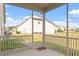 Cozy screened porch offering views of the backyard and surrounding neighborhood at 404 Lily Pad Ct, Zebulon, NC 27597