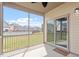 Covered screened in back porch showing sliding glass doors to the home's interior at 404 Lily Pad Ct, Zebulon, NC 27597