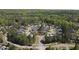 Residential community with well-maintained homes and manicured lawns in a serene, wooded setting at 4331 Millcreek Cir, Pittsboro, NC 27312