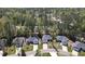 Residential neighborhood showcasing beautiful homes surrounded by lush greenery and mature trees at 4331 Millcreek Cir, Pittsboro, NC 27312
