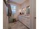 Contemporary bathroom with dual sinks, and a glass enclosed shower for a spa-like experience at 4331 Millcreek Cir, Pittsboro, NC 27312