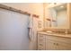 Well-lit bathroom with neutral tones, vanity, and convenient towel rack at 4331 Millcreek Cir, Pittsboro, NC 27312