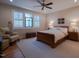 Comfortable bedroom featuring a ceiling fan, and a beautifully arranged bed at 4331 Millcreek Cir, Pittsboro, NC 27312