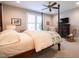 Bedroom featuring four-poster bed, ceiling fan, window, and vintage furniture at 4331 Millcreek Cir, Pittsboro, NC 27312