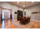Traditional dining room featuring hardwood floors, a chandelier, and a vintage china cabinet at 4331 Millcreek Cir, Pittsboro, NC 27312
