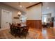 Elegant dining area with wood floors and trim, seamlessly connects to the living room and kitchen at 4331 Millcreek Cir, Pittsboro, NC 27312