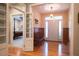 Inviting entryway with hardwood floors, front door, and wooden bench seating at 4331 Millcreek Cir, Pittsboro, NC 27312