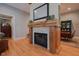 Charming fireplace with rustic wood mantel and stone surround details at 4331 Millcreek Cir, Pittsboro, NC 27312