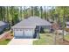 Charming home with a two car garage, manicured lawn, and well-maintained landscaping at 4331 Millcreek Cir, Pittsboro, NC 27312