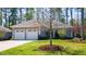 Charming home with a well-manicured lawn and two-car garage offering a welcoming curb appeal at 4331 Millcreek Cir, Pittsboro, NC 27312