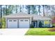 Charming single-story home with a two-car garage, well-kept lawn, and inviting curb appeal at 4331 Millcreek Cir, Pittsboro, NC 27312