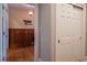 Bright hallway featuring a wooden bench and white closet with panel design at 4331 Millcreek Cir, Pittsboro, NC 27312