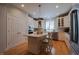 Well-lit kitchen featuring a center island, stainless steel appliances, and white cabinetry at 4331 Millcreek Cir, Pittsboro, NC 27312