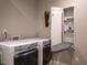 Efficient laundry area with modern appliances and built-in ironing board at 4331 Millcreek Cir, Pittsboro, NC 27312