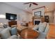 Inviting living room with a fireplace, comfortable seating, and hardwood floors at 4331 Millcreek Cir, Pittsboro, NC 27312