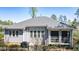 Charming home with a screened porch, gray roof, and fenced backyard, perfect for outdoor living at 4331 Millcreek Cir, Pittsboro, NC 27312