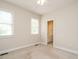 Neutral bedroom with carpet flooring and a view into an ensuite bathroom at 4501 Forest Dr, Holly Springs, NC 27540