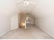 Large bonus room featuring carpet and entryways to additional spaces at 4501 Forest Dr, Holly Springs, NC 27540