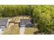 Aerial view of home, highlighting the expansive fenced backyard, landscaping, and spacious driveway at 479 Kotata Ave, Bunnlevel, NC 28323