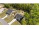 Aerial view showcasing the property's fenced backyard, proximity to neighbors, and spacious driveways at 479 Kotata Ave, Bunnlevel, NC 28323