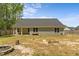 Backyard featuring green grass, with a house with siding and windows at 479 Kotata Ave, Bunnlevel, NC 28323