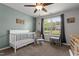 Welcoming Bedroom with crib, chair and large window providing natural light at 479 Kotata Ave, Bunnlevel, NC 28323