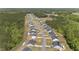 Aerial shot of homes in a wooded neighborhood, showcasing a quiet and Gathering-friendly community at 479 Kotata Ave, Bunnlevel, NC 28323