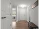 Bright foyer with light walls, wood-look floors, and a stylish wooden bench, creating a welcoming entry at 479 Kotata Ave, Bunnlevel, NC 28323