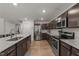 Kitchen featuring stainless steel appliances, granite countertops, and wood-look flooring at 479 Kotata Ave, Bunnlevel, NC 28323