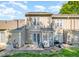 Back exterior with a small patio, grill, and lush lawn at 48 Fashion Pl, Durham, NC 27705