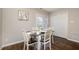 Charming dining area with hardwood floors and sliding door access to the outside at 48 Fashion Pl, Durham, NC 27705