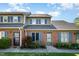 Charming brick townhomes with blue shutters and well-maintained landscaping creates a welcoming curb appeal at 48 Fashion Pl, Durham, NC 27705